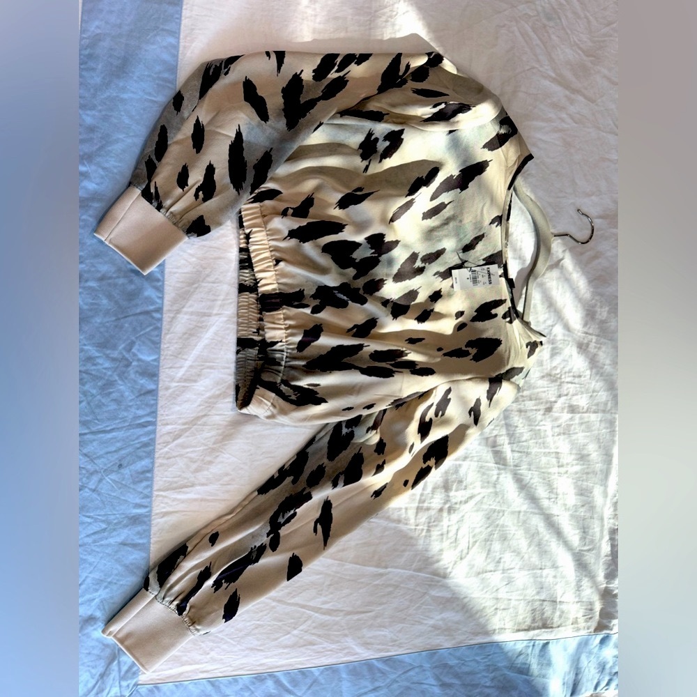 Two Polyester crop top blouses in size M with shoulder pads.